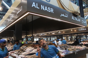 A man at a fish market stall in Abu Dhabi